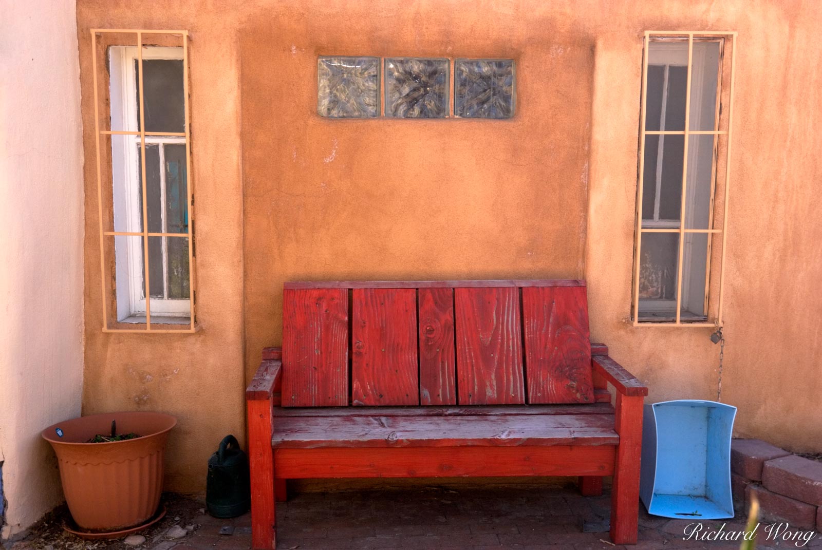 Red Bench Against Adobe Wall at Old Town Plaza, Albuquerque, New Mexico