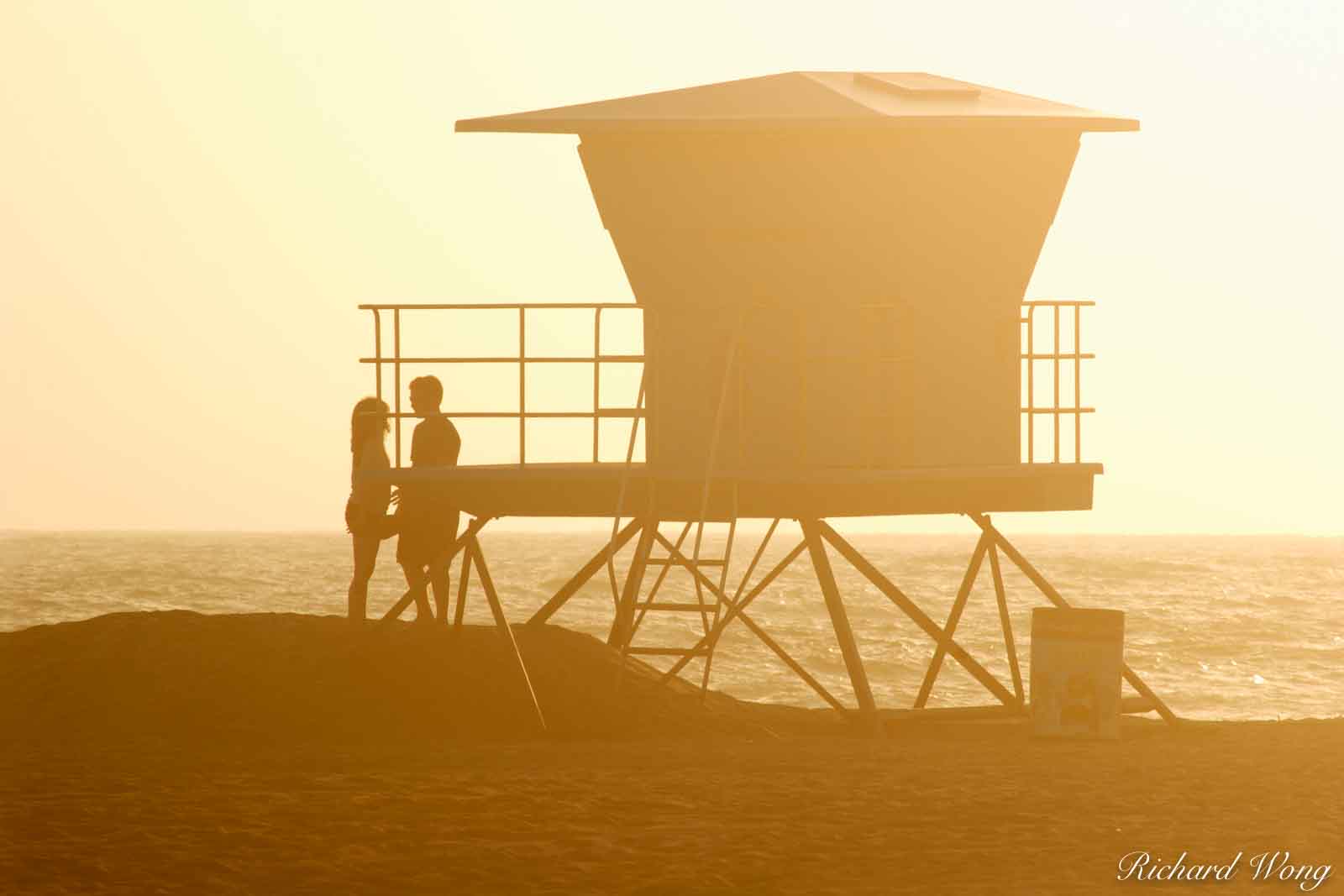 Couple About to Share a Romantic Kiss Next to Lifeguard Tower at Huntington State Beach, Huntington Beach, California, photo